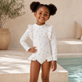 Gentle Nest model hero — Princess Printed Ruffles Long Sleeve Swimsuit, White, worn by Zuri (GN-C04)