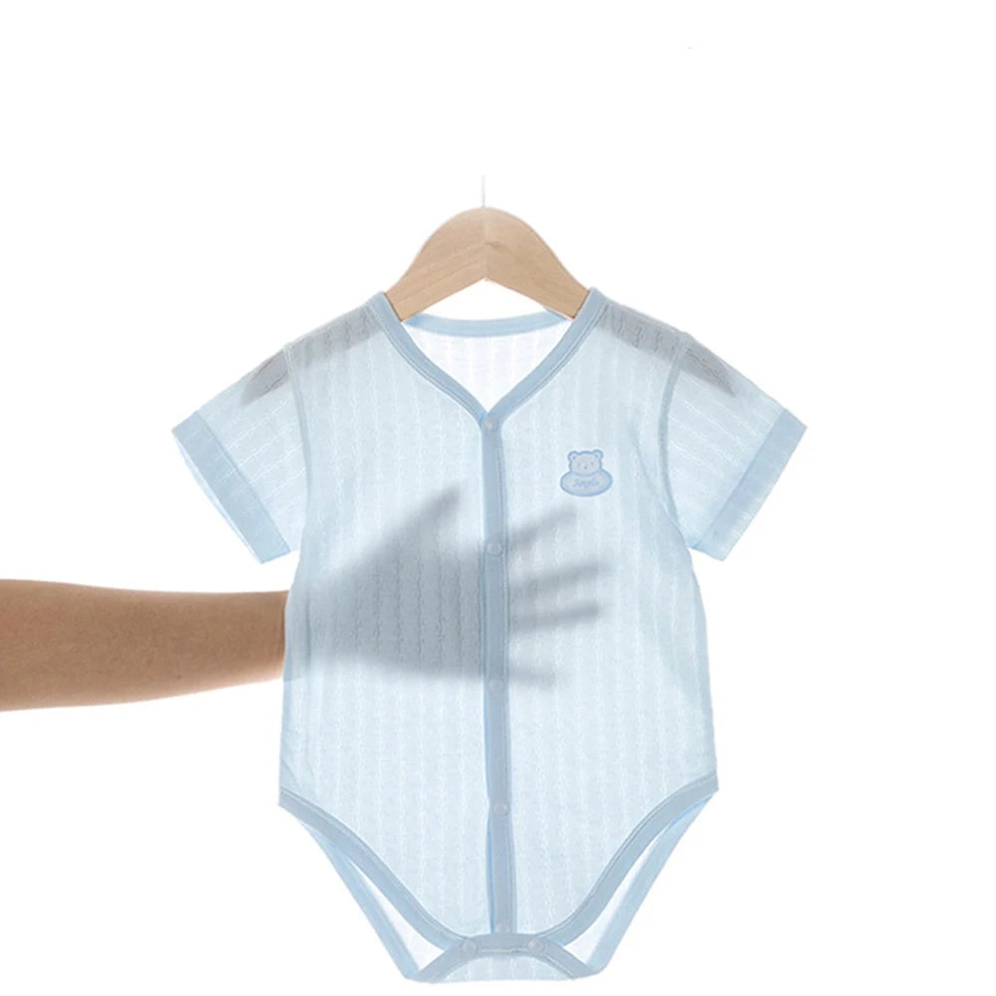 Blue knit short sleeve bodysuit on hanger