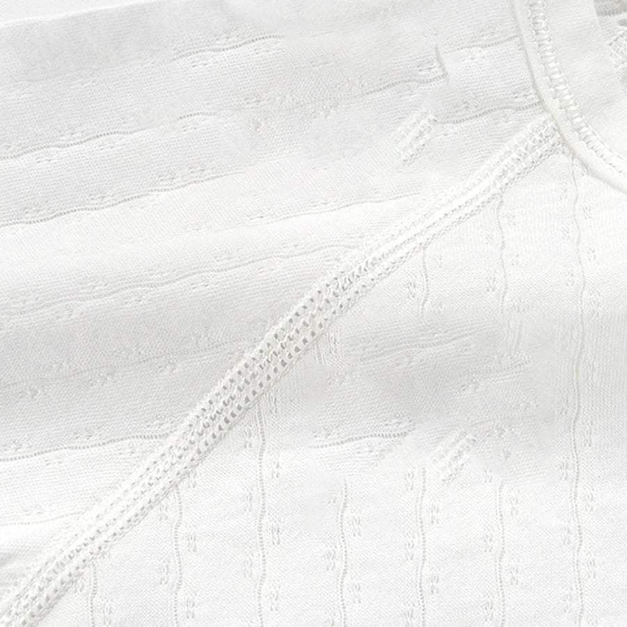 Close view of knit-look texture on bodysuit