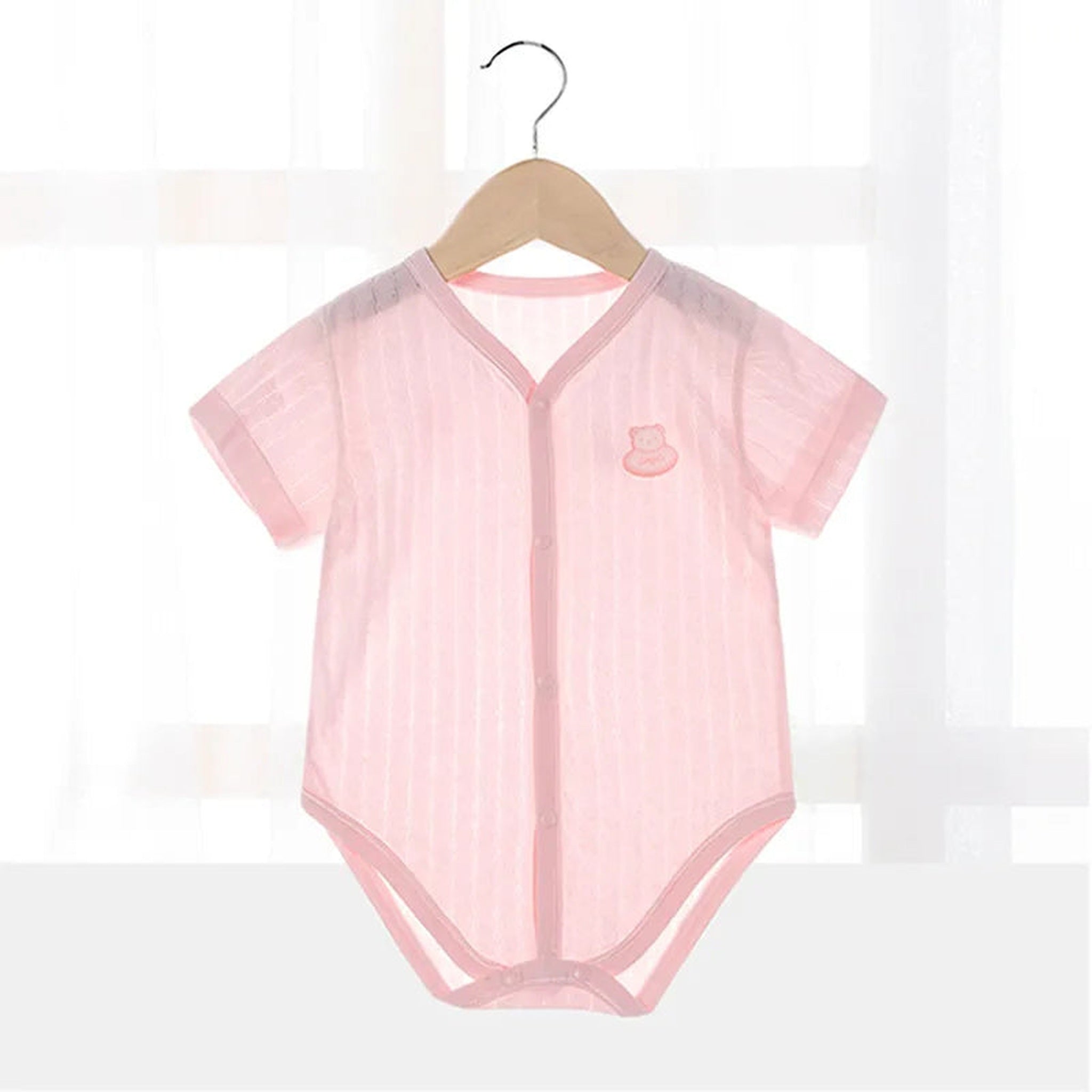 Pink knit short sleeve bodysuit