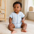 Gentle Nest model hero — Knit Short Sleeve Bodysuit, Blue, worn by Nia (GN-B03)