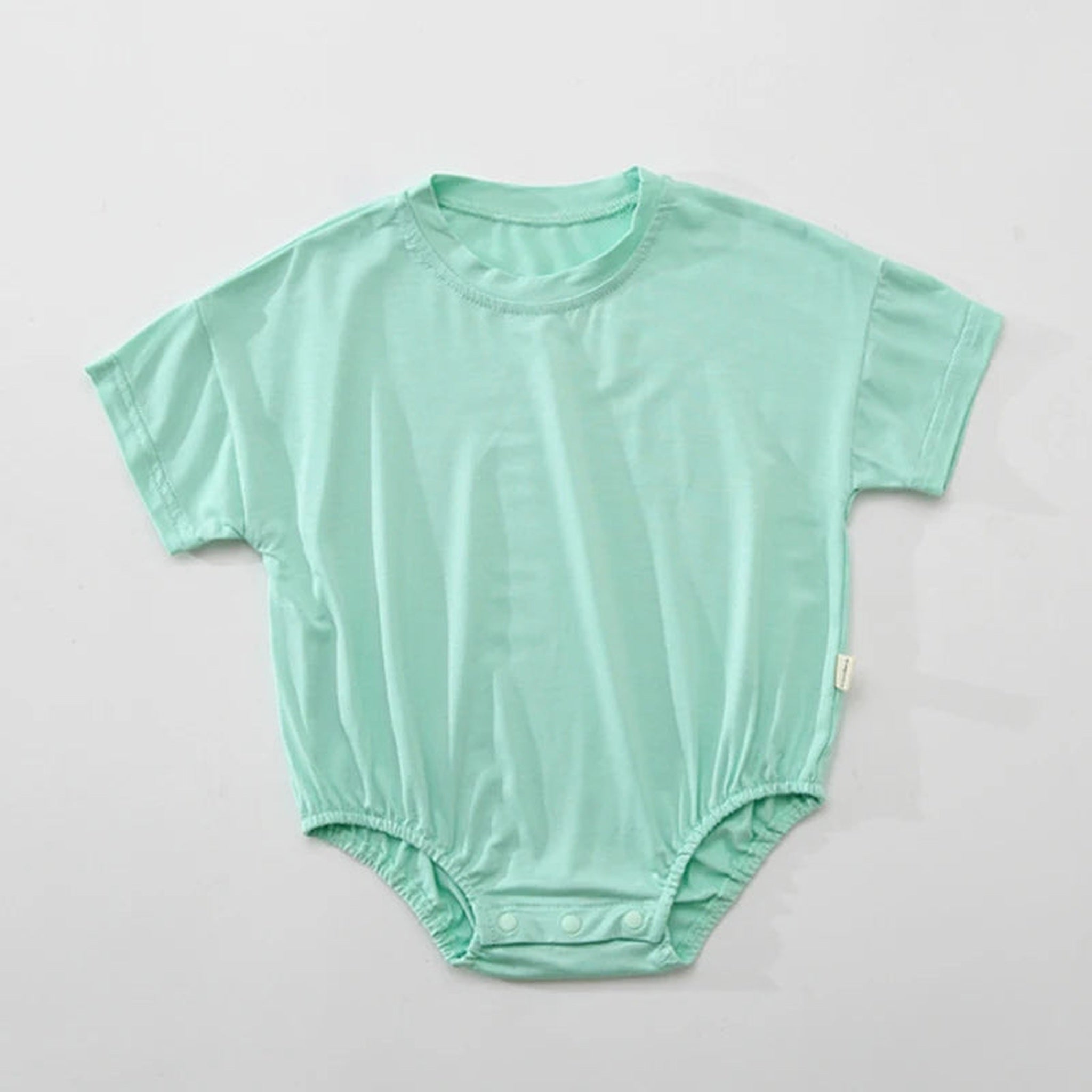Green short sleeve bubble romper detail