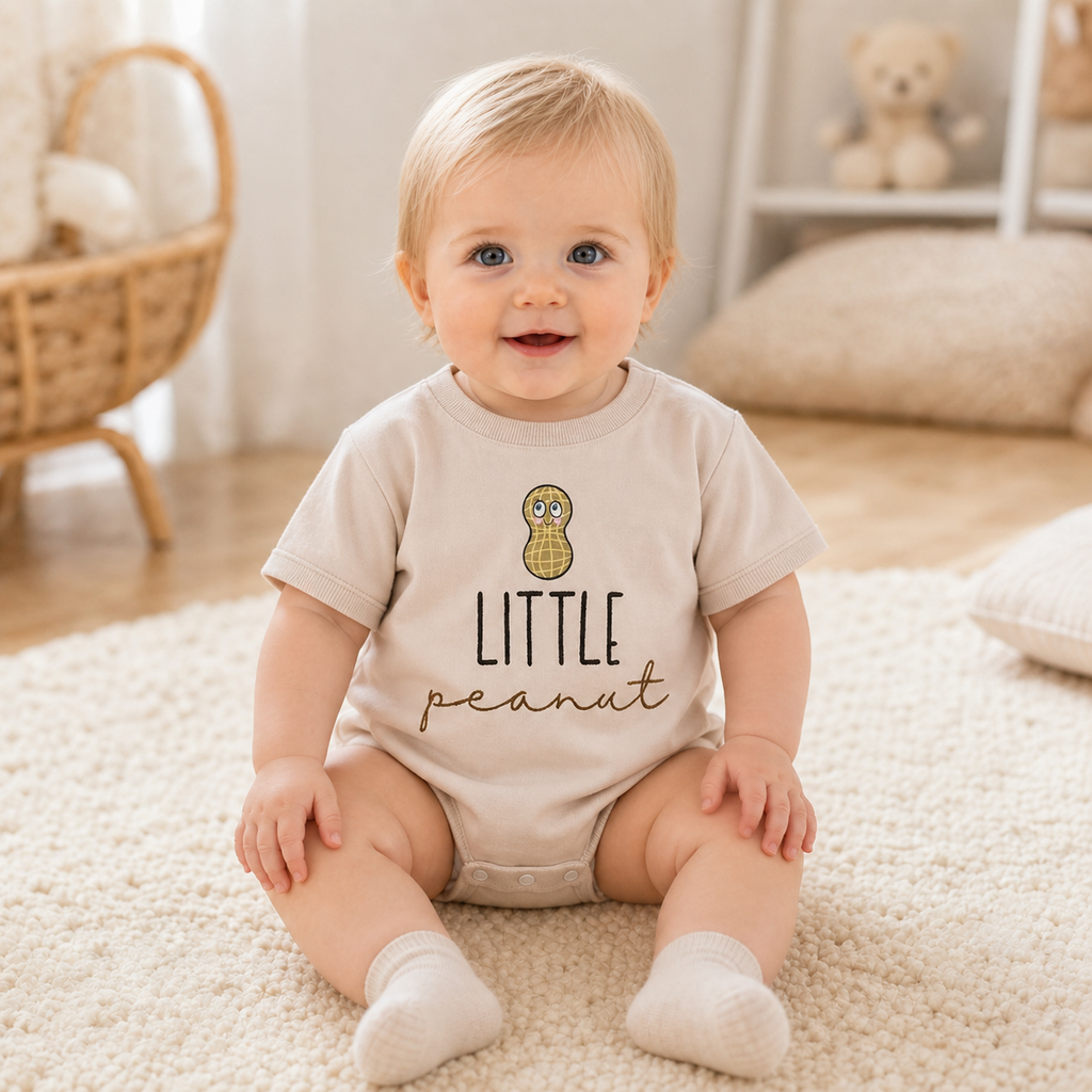 Gentle Nest model hero — Little Peanut Print Romper, worn by Clara (GN-B04)