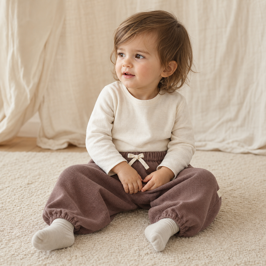 Toddler wearing Loose Waffle Knit Pants in Brown