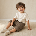 Child wearing Loose Cargo Pocket Pants in Brown