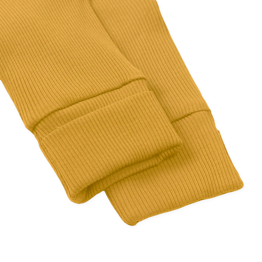 Ribbed Botanical Heavyweight Romper — Golden Mustard — Cuff and foot detail — image 7