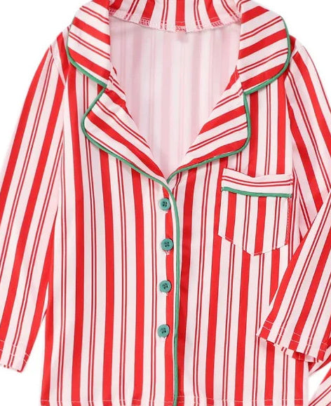 Red and white striped pajama top with green collar trim and button front, close-up