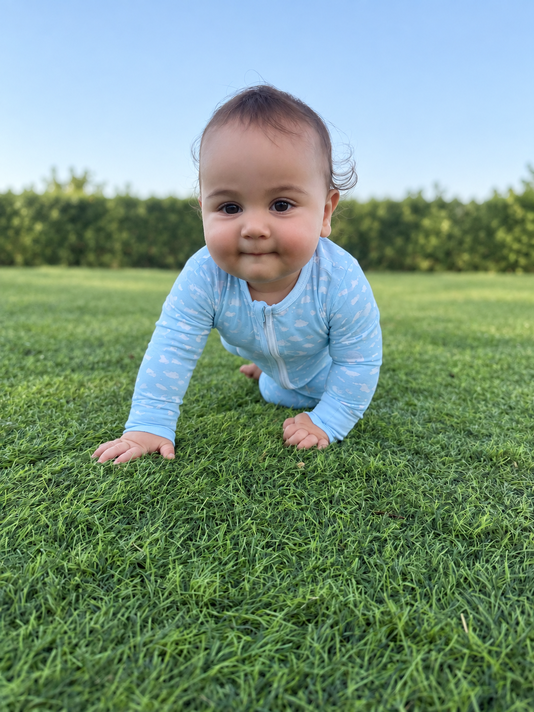 Jordan modeling the Blue Clouds Romper by GentleNest Co.