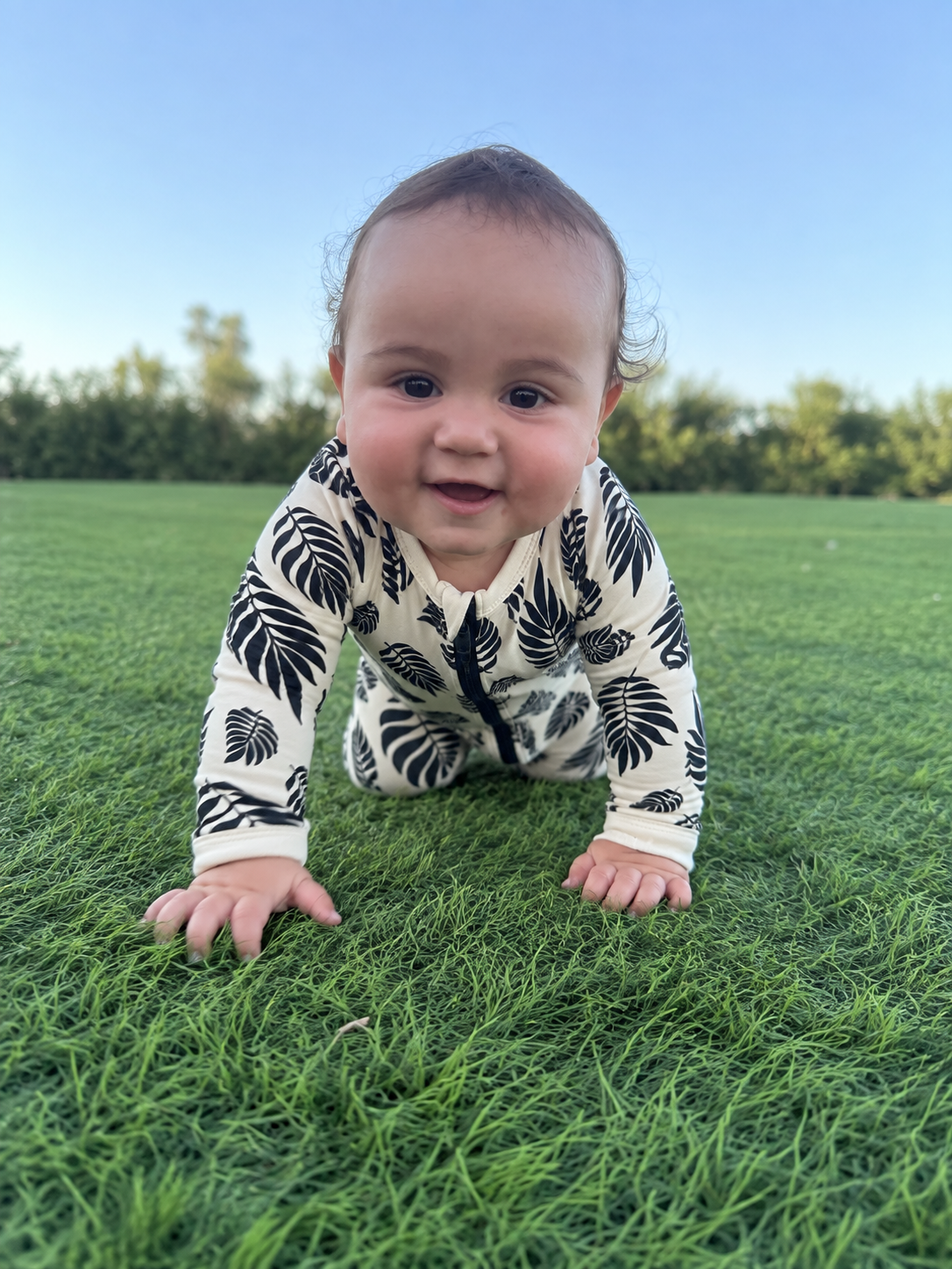 Jordan modeling the Botanical Leaves Romper by GentleNest Co.