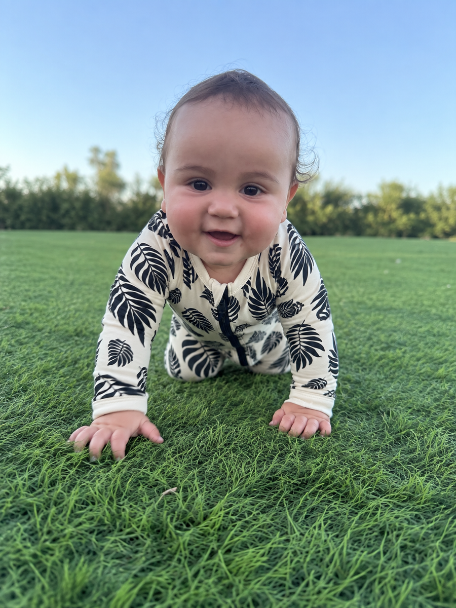 Jordan modeling the Botanical Leaves Romper by GentleNest Co.
