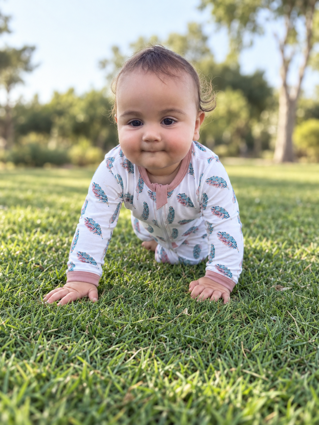Jordan modeling the Feathers Romper by GentleNest Co.