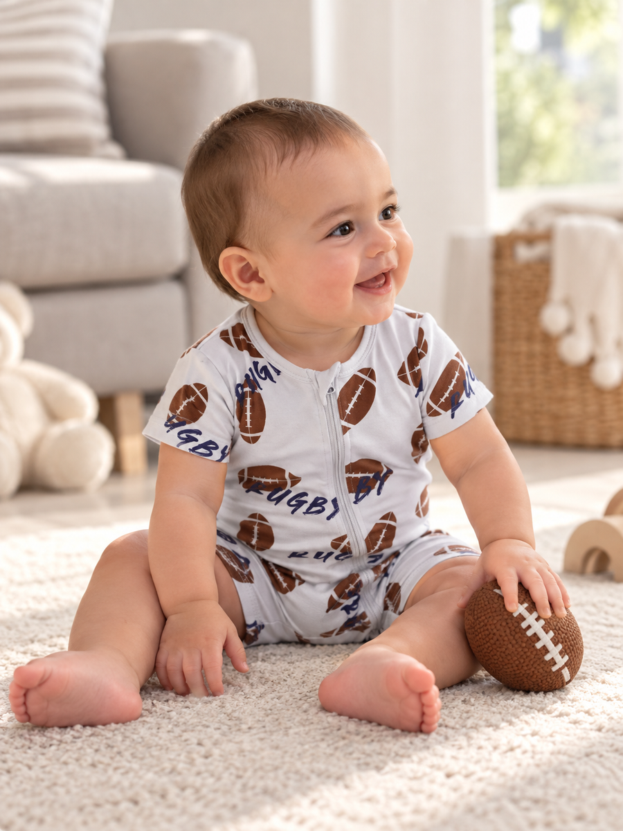 Baby wearing Football Shortie two-way zip romper
