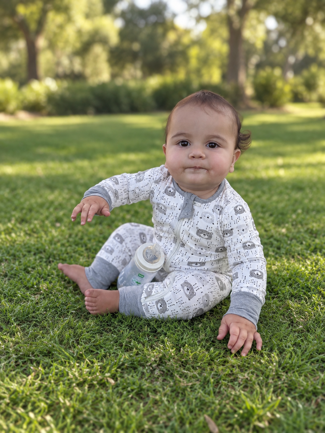 Jordan modeling the Gray City Romper by GentleNest Co.