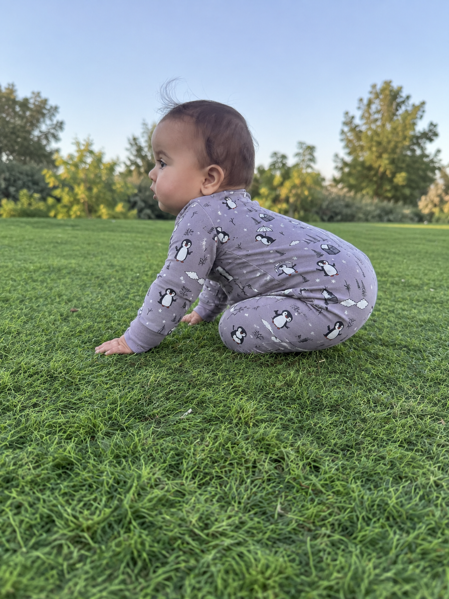 Jordan modeling the Gray Penguins Romper by GentleNest Co.