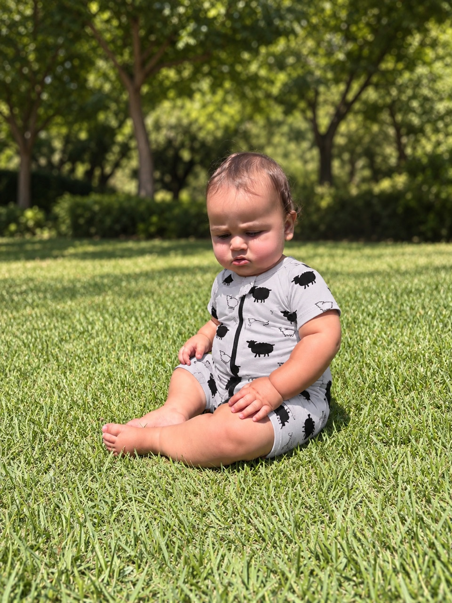 Jordan wearing the Counting Sheep Shortie Romper