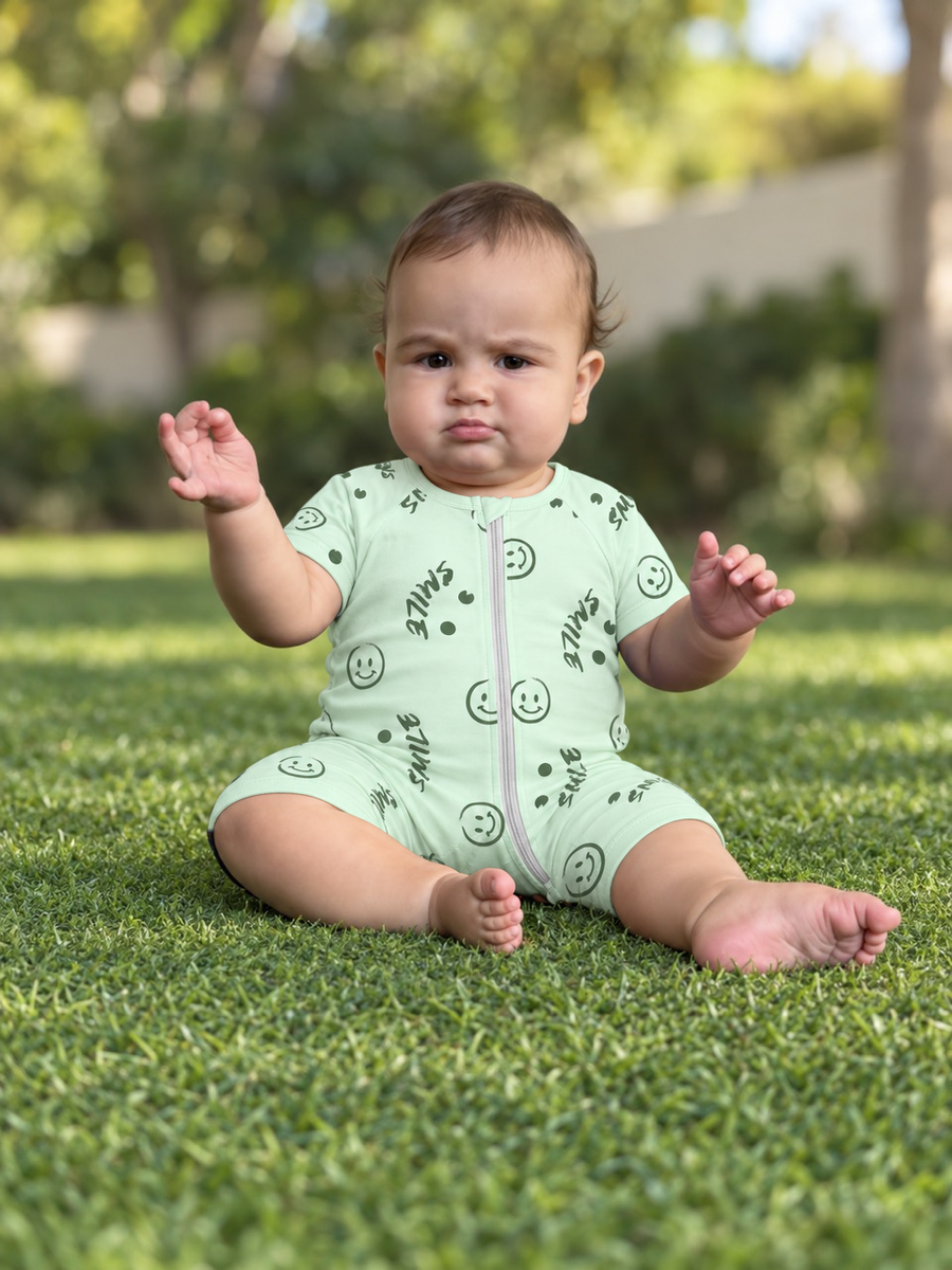 Jordan wearing the Mint Smileys Shortie Romper