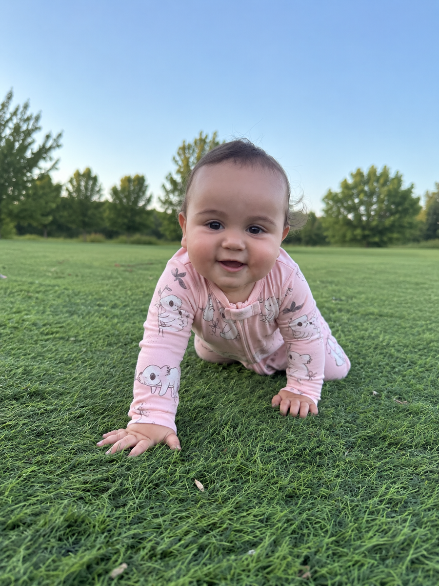Jordan modeling the Koala Footed Romper by GentleNest Co.