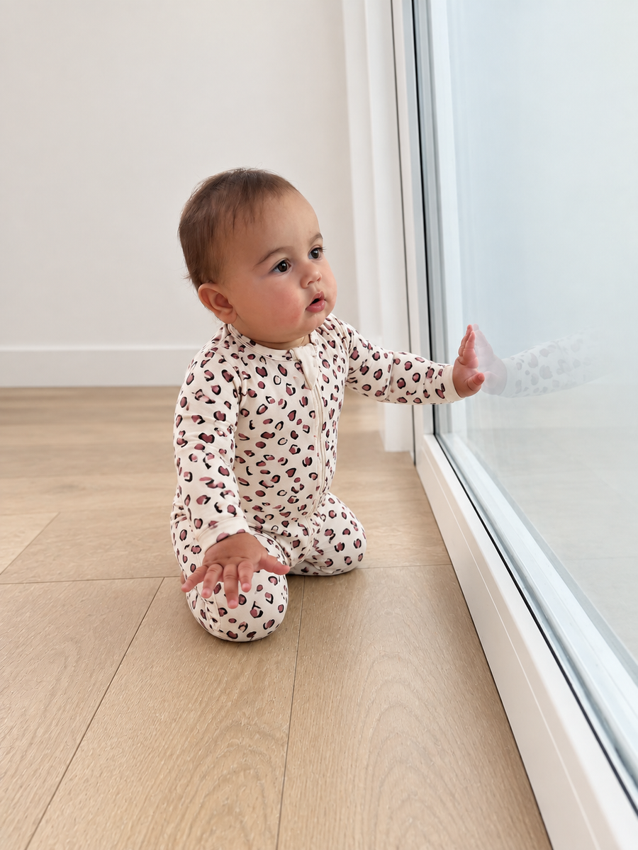 Jordan modeling the Leopard Footed Romper by GentleNest Co.