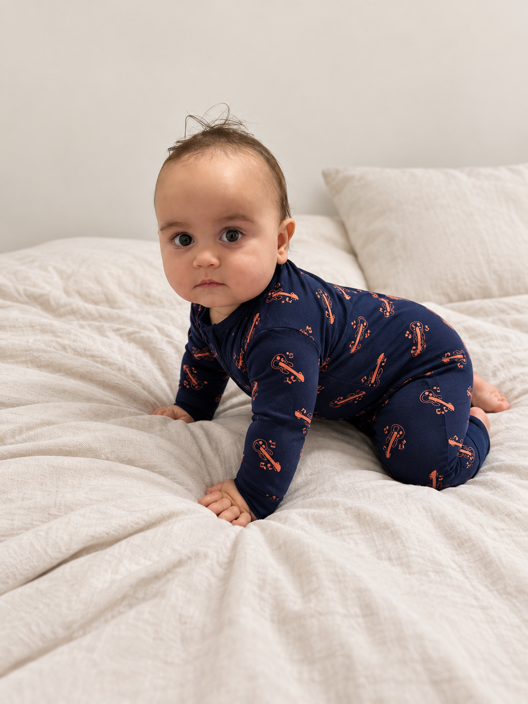 Jordan modeling the Midnight Guitars Romper by GentleNest Co.