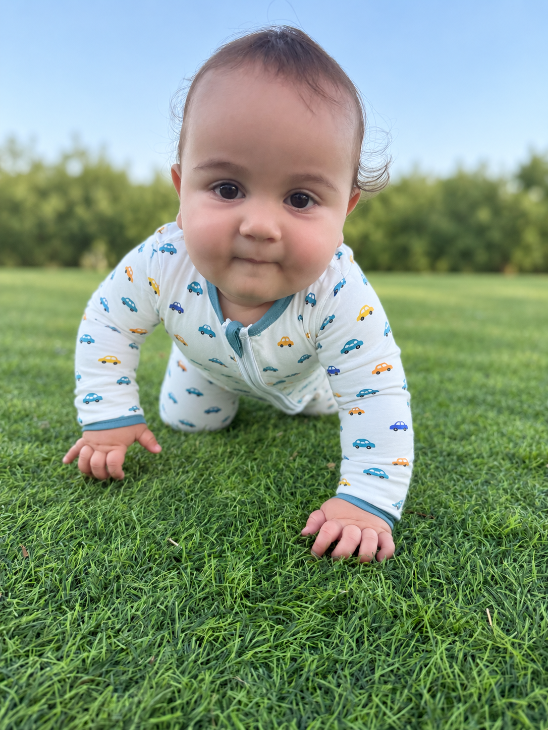 Jordan modeling the Mini Cars Romper by GentleNest Co.