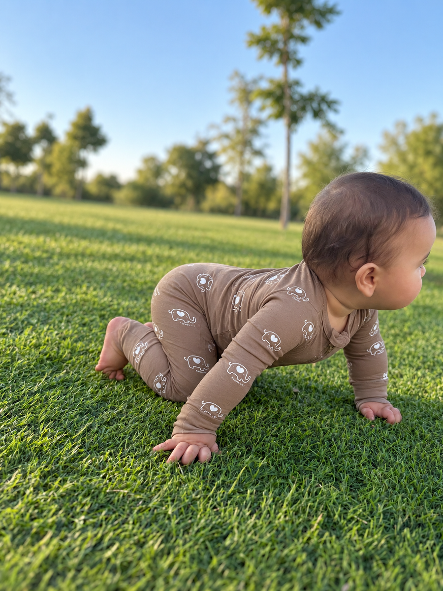 Jordan modeling the Mocha Elephants Romper by GentleNest Co.