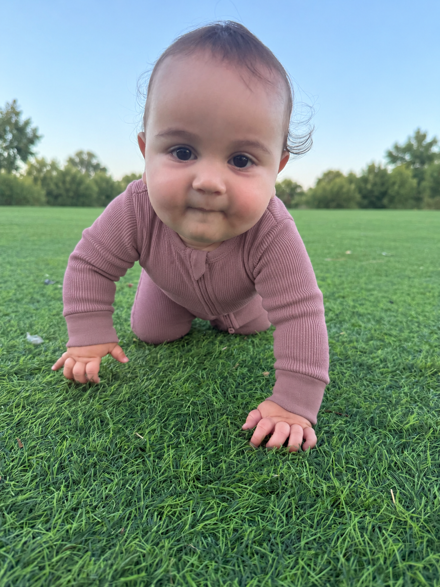 Jordan modeling the Ribbed Essentials Romper by GentleNest Co.