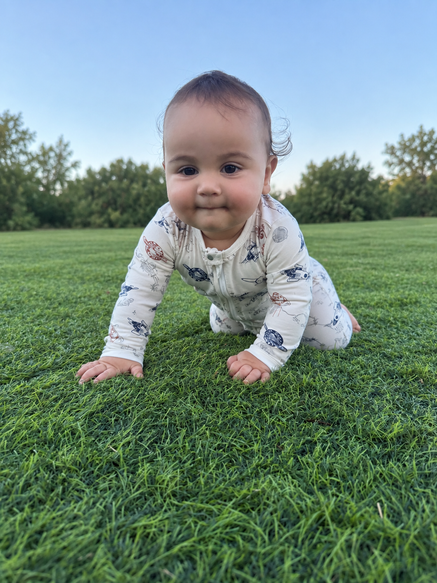 Jordan modeling the Space Sketch Romper by GentleNest Co.