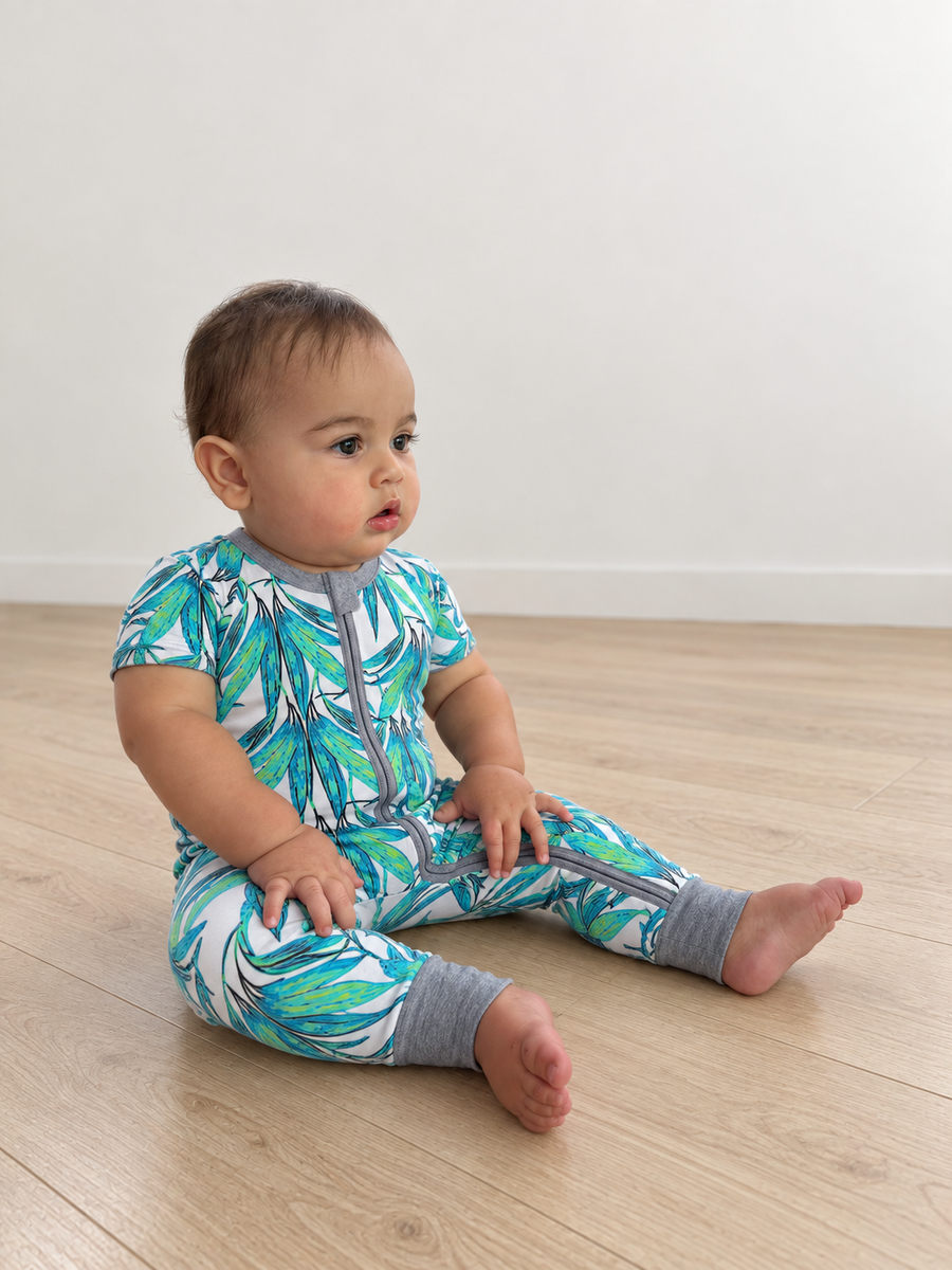 Jordan modeling the Tropical Leaves Short-Sleeve Romper by GentleNest Co.