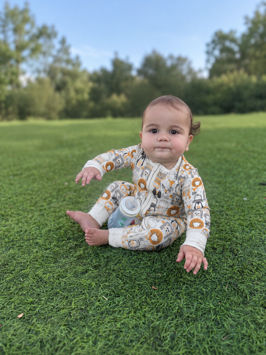 Jordan modeling the Woodland Friends Romper by GentleNest Co.