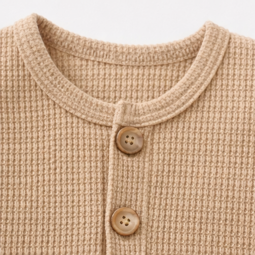 Collage of a beige baby romper with close-up details on a white background
