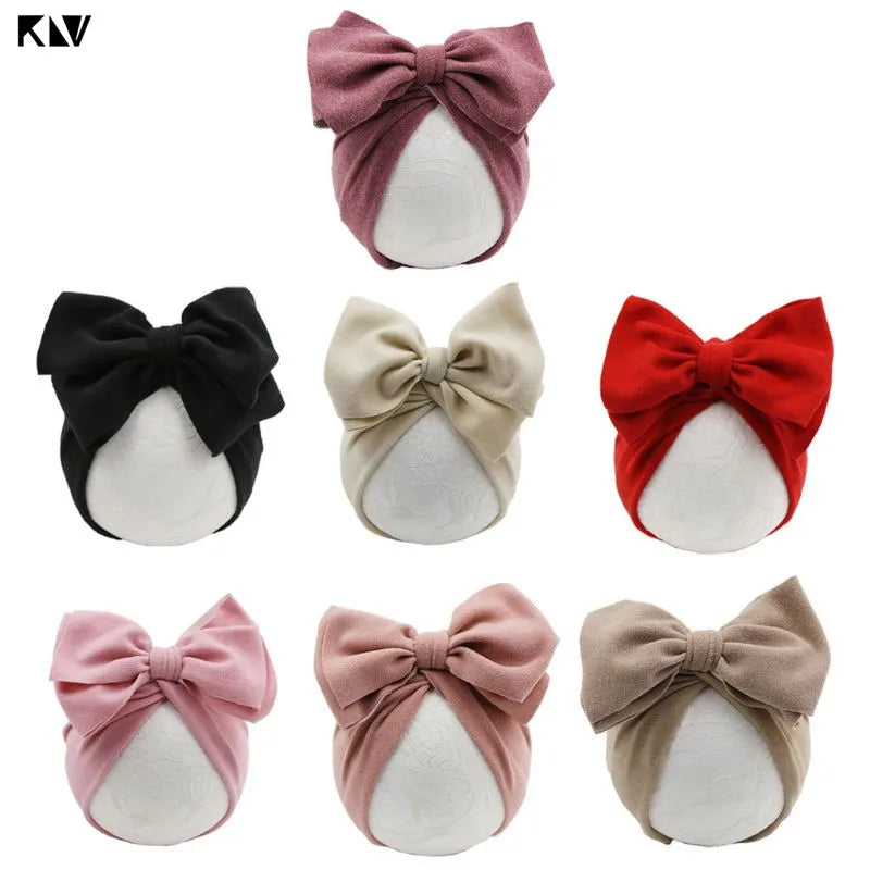 Adjustable Bow Baby Hat in soft cotton and acrylic blend