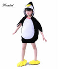 Child wearing black and white penguin hooded dress costume with yellow foot covers