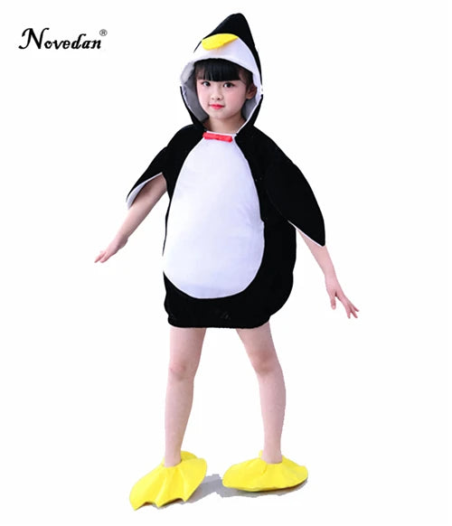 Child wearing black and white penguin hooded dress costume with yellow foot covers