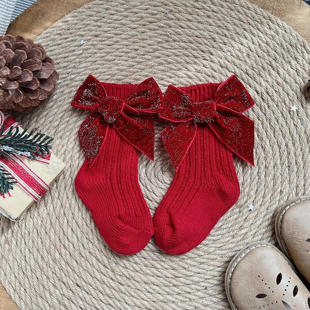 Red ribbed knee-high socks with glitter bows
