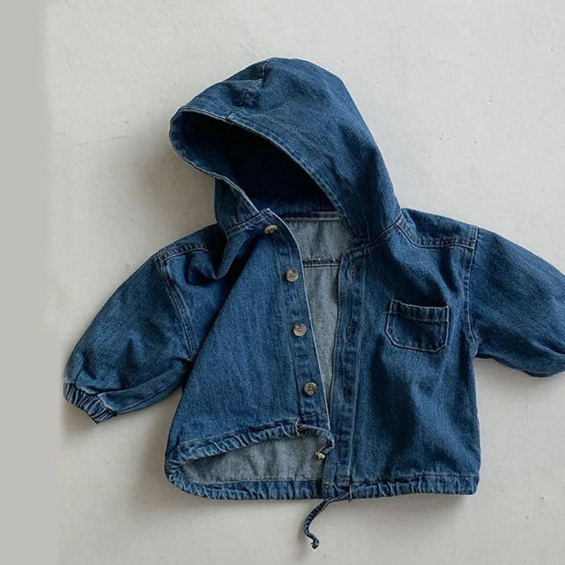Close-up of fabric texture on autumn denim and corduroy hooded jacket