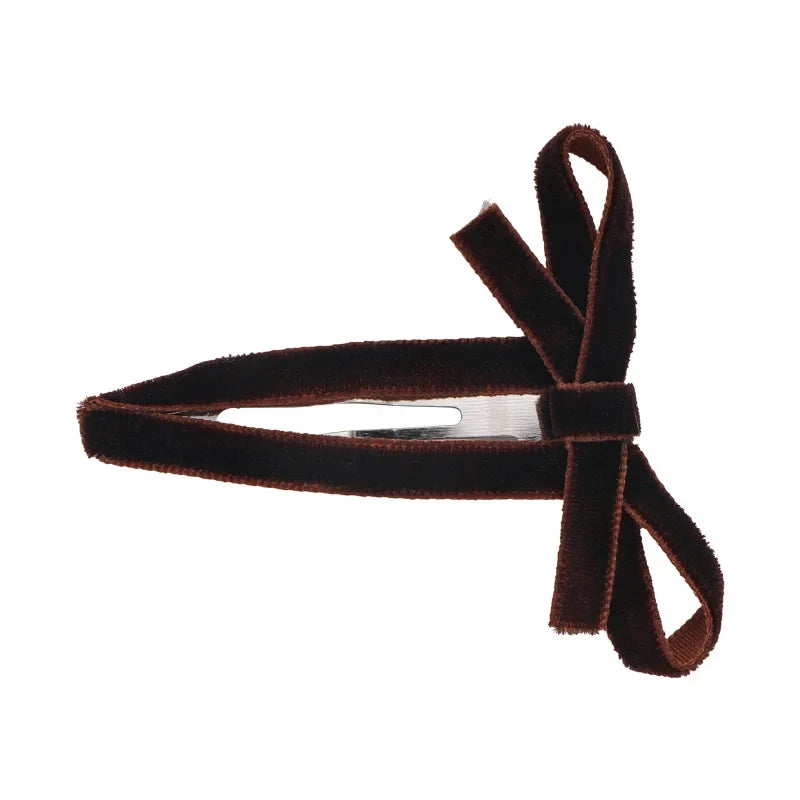 Brown ribbon-covered snap hair clip with a narrow matching bow on a white background.