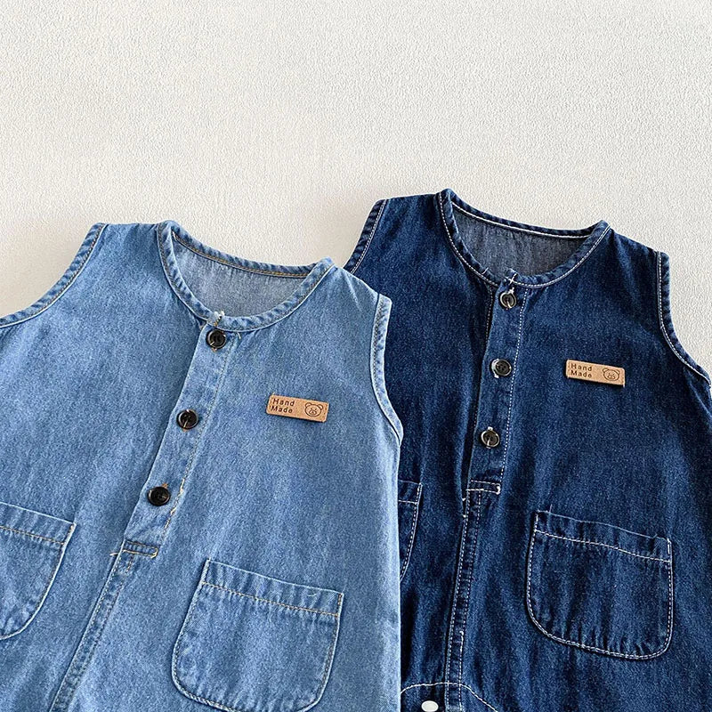 Baby wearing soft denim romper and bucket hat