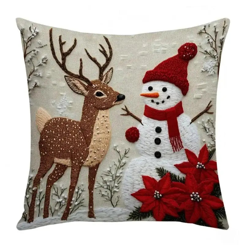 Christmas deer and snowman pillow cover, C, featuring a deer and a snowman with red winter accessories and poinsettias.