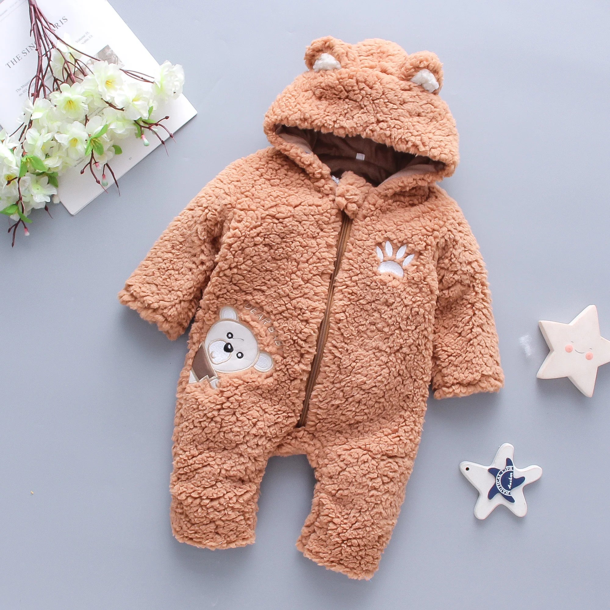 Side view of lamb hair baby romper with cartoon bear embroidery