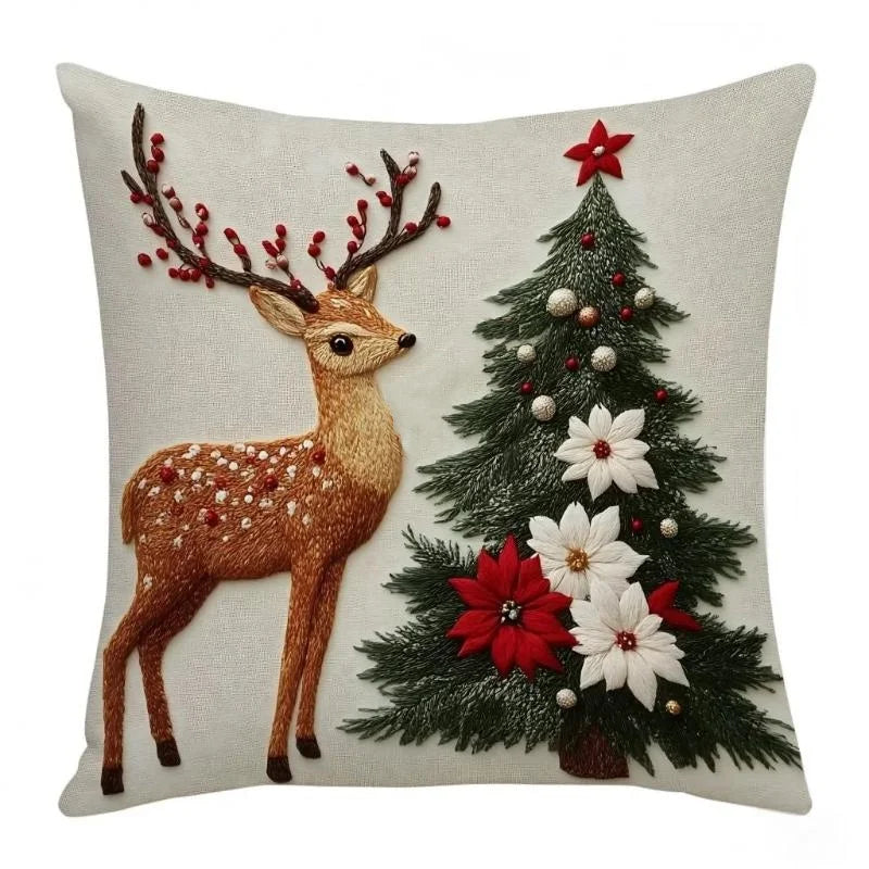 Christmas deer and tree pillow cover, A, featuring a deer beside a Christmas tree, with red and white poinsettias.