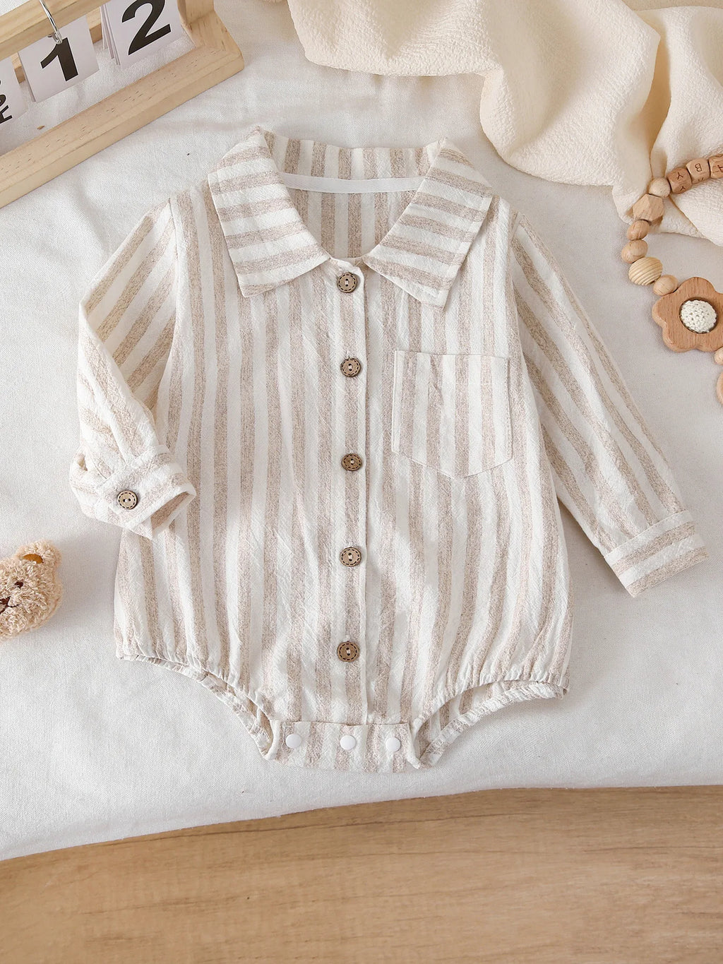 Front view of Striped Long-Sleeve Bodysuit with Single-Row Buttons