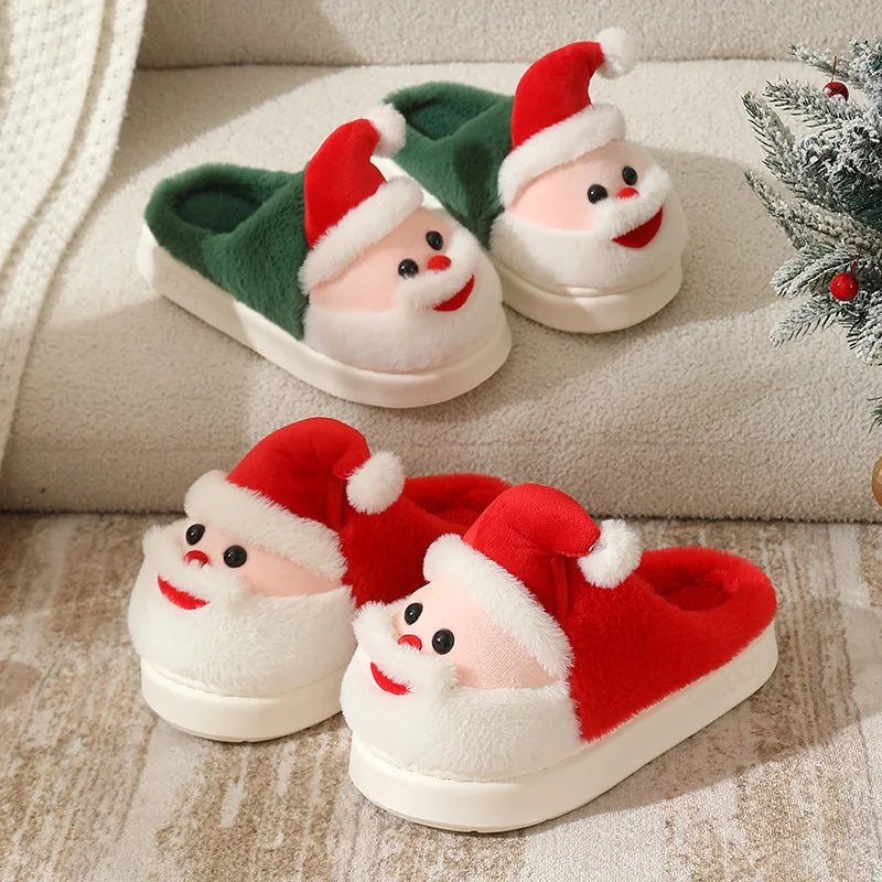 Red and green slip-on slippers with raised Santa faces, white beards, red hats, and cream soles.