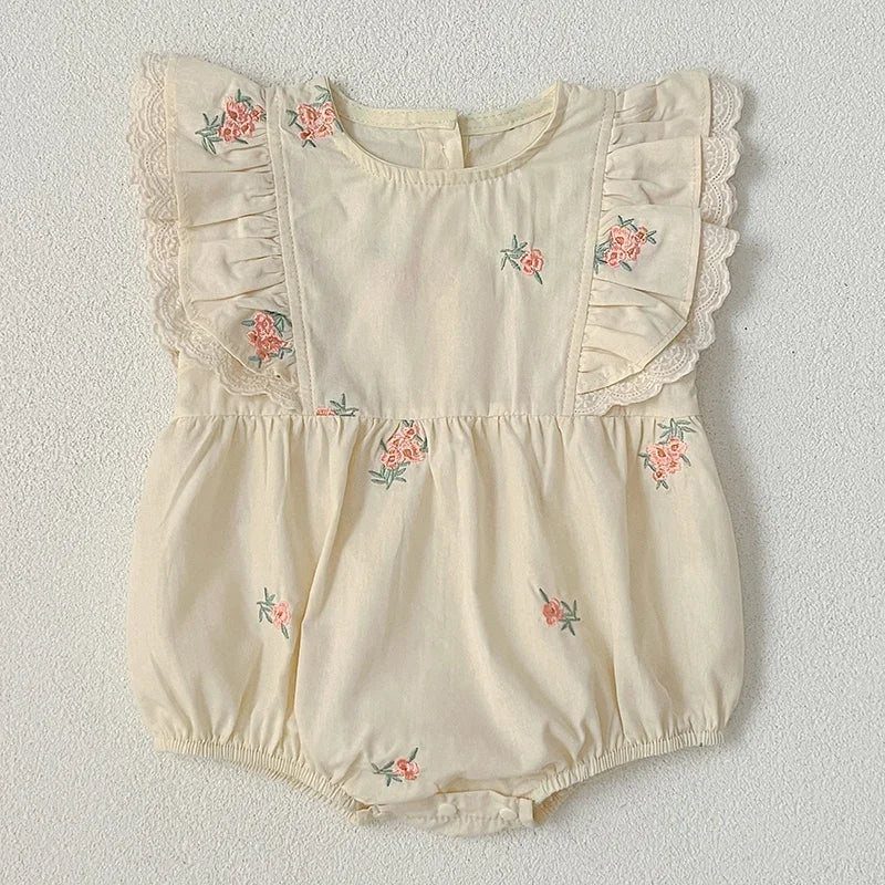 Back view of baby girl floral embroidered bodysuit