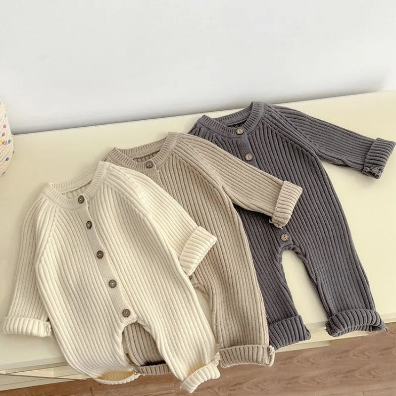 Front view of knitted solid color baby bodysuit