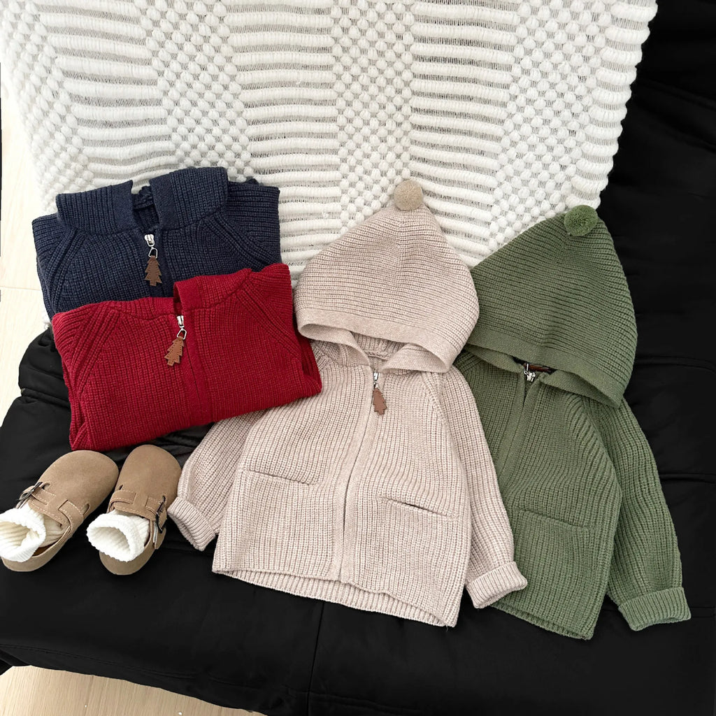Baby wearing warm knit hooded coat in red color
