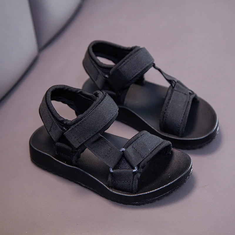 Black sport sandals with hook-and-loop straps