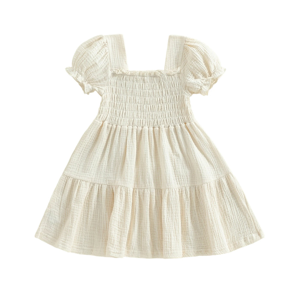 Ivory smocked puff-sleeve dress on white background