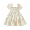 Ivory smocked puff-sleeve dress on white background