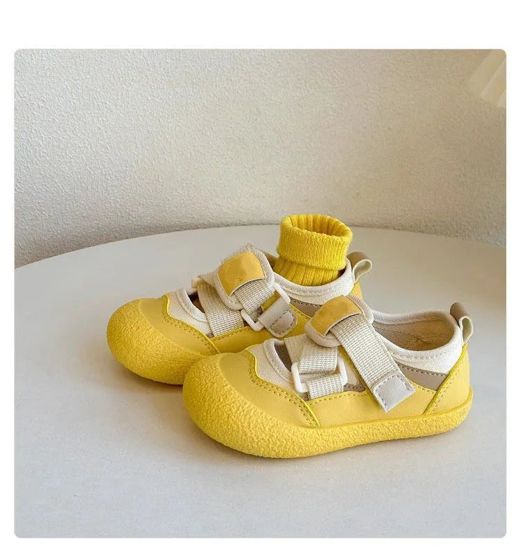 Pair of sunny yellow hook-and-loop play shoes
