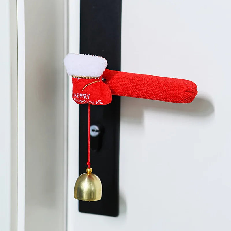 Red fabric door handle cover with a Christmas stocking design and hanging bell